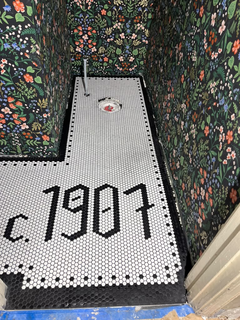 Custom tiled powder room floor