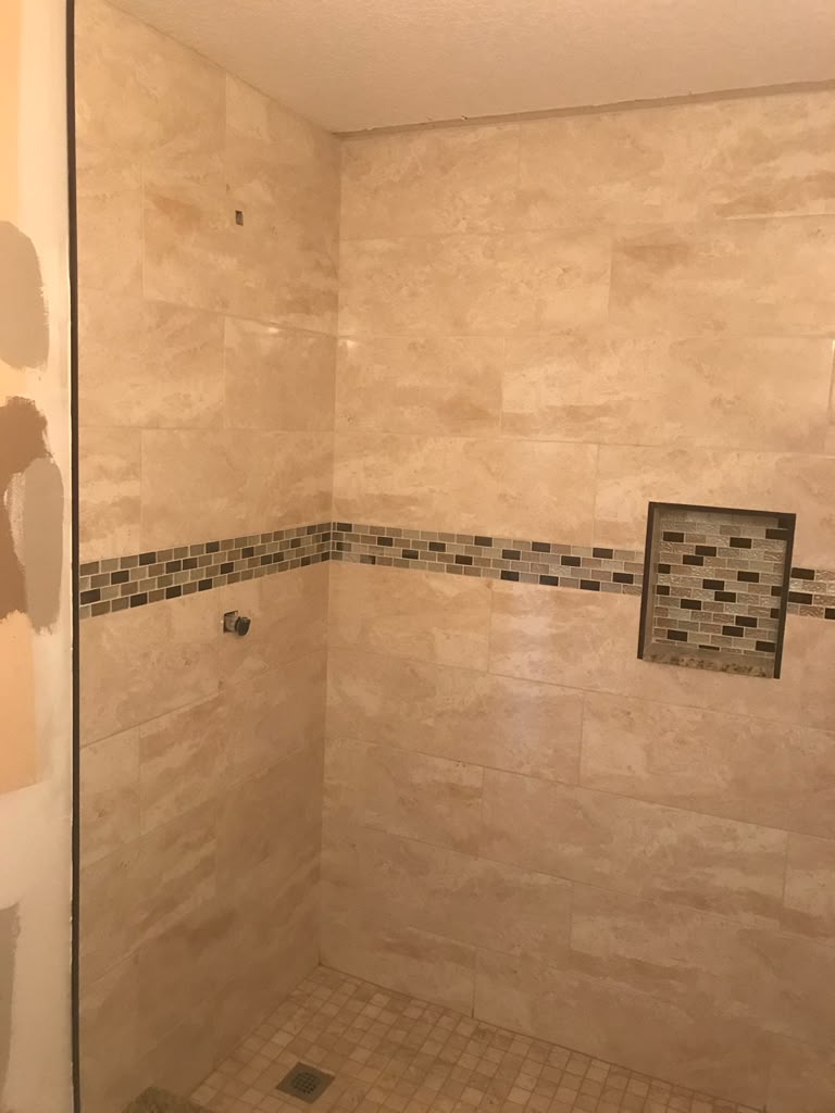 Neutral tiled walk-in shower renovation