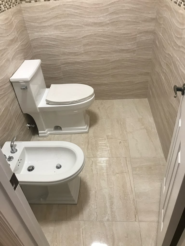 Fully tiled bathroom with modern fixtures