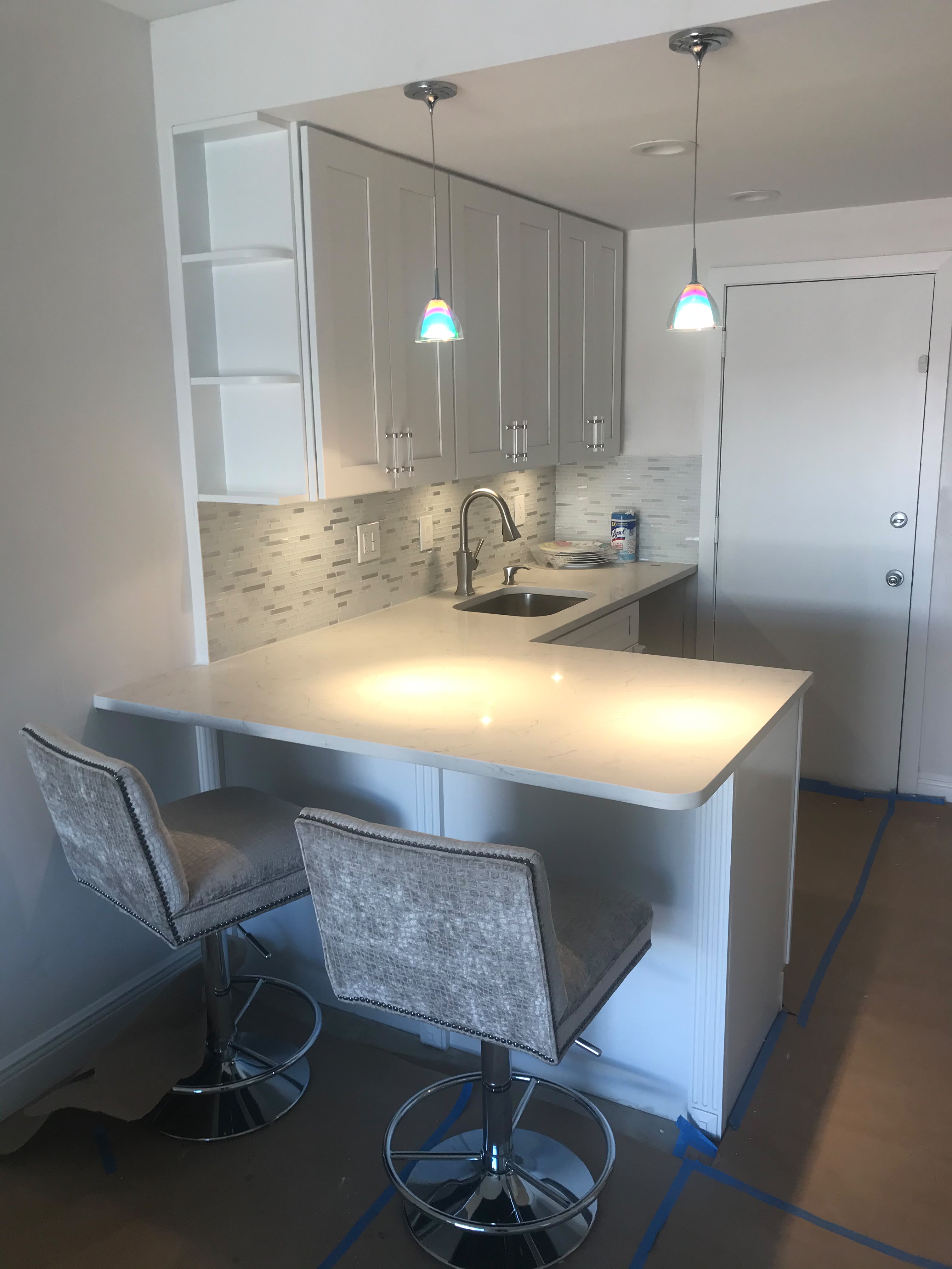 Compact white kitchen and breakfast bar