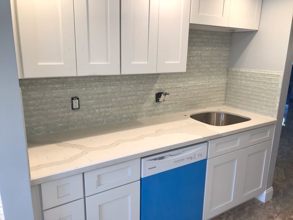 White kitchen countertop and new sink installation